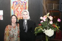 Zahra Nazarbageh and Laurie with Buddha painting at NAC reception